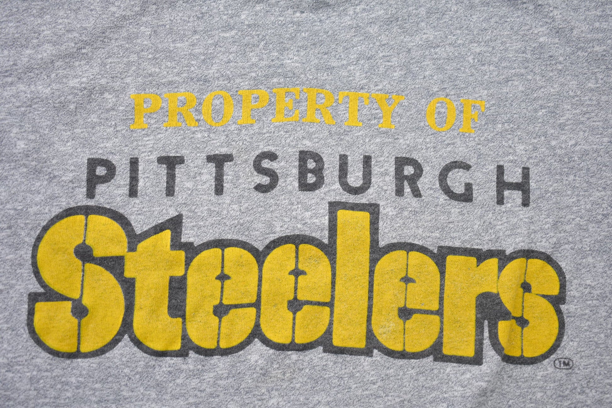 Proper Vintage Clothing > Gender Neutral Adult Clothing > Tops & Tees > T Shirts Vintage 1980s Property of Pittsburgh Steelers NFL Graphic T-Shirt / Single Stitch / NFL / 80s Streetwear / Athleisure / Sportswear