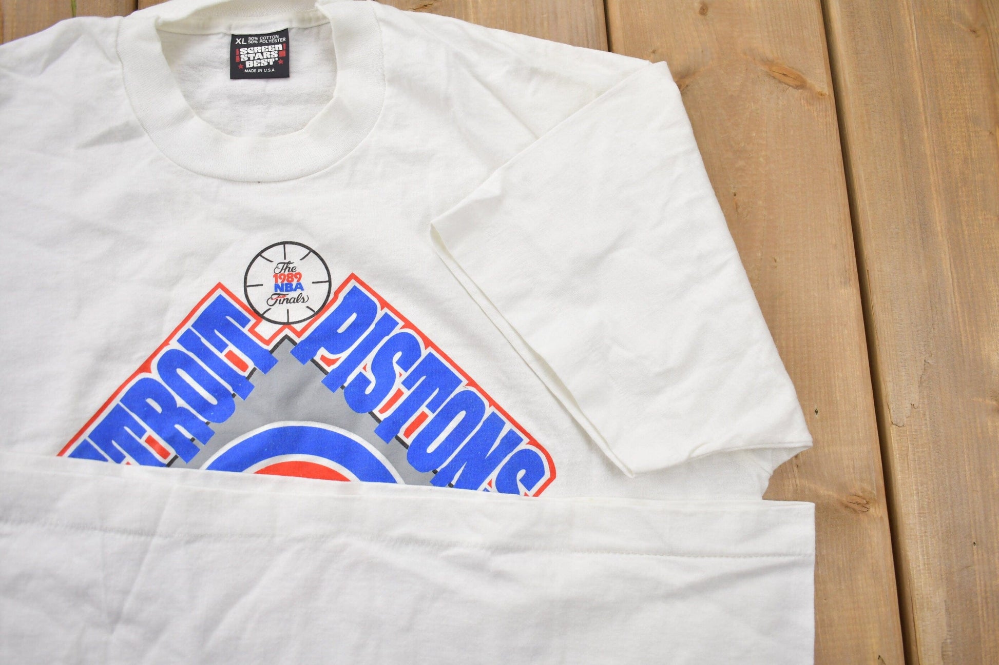 Proper Vintage Clothing > Gender Neutral Adult Clothing > Tops & Tees > T Shirts Vintage 1989 Detroit Pistons NBA Eastern Conference Champions Graphic T-Shirt / Made In USA / Single Stitch / NBA Basketball / Bad Boys