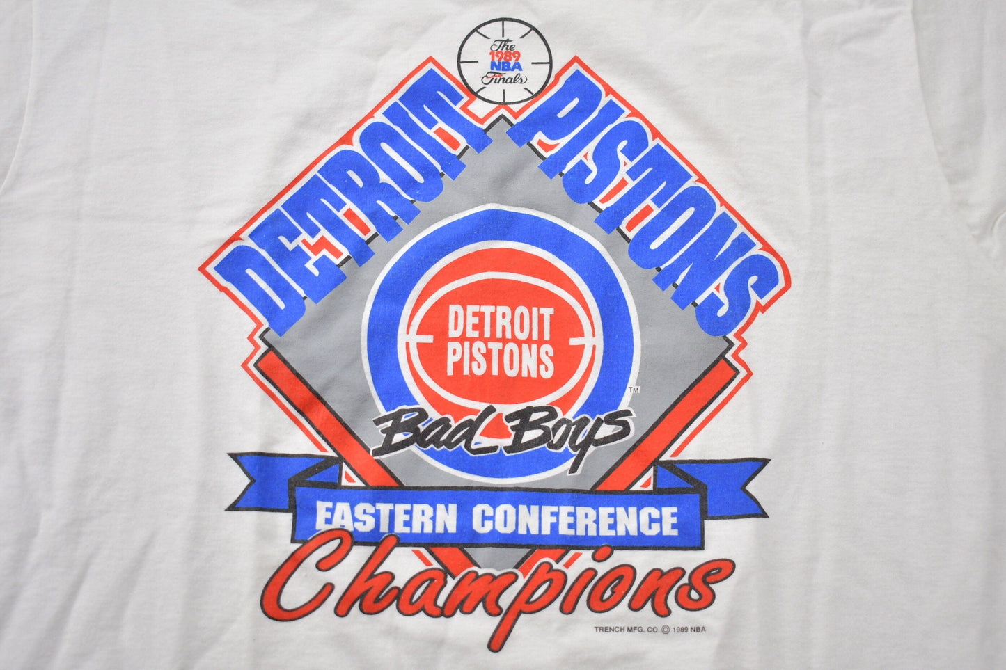 Proper Vintage Clothing > Gender Neutral Adult Clothing > Tops & Tees > T Shirts Vintage 1989 Detroit Pistons NBA Eastern Conference Champions Graphic T-Shirt / Made In USA / Single Stitch / NBA Basketball / Bad Boys