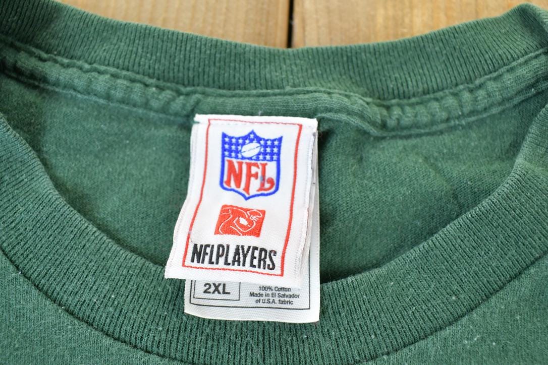 Proper Vintage Clothing > Gender Neutral Adult Clothing > Tops & Tees > T Shirts Vintage 1990s AJ Hawk Green Bay Packers NFL T-Shirt / Made In USA / Single Stitch / 90s Streetwear / Sportswear