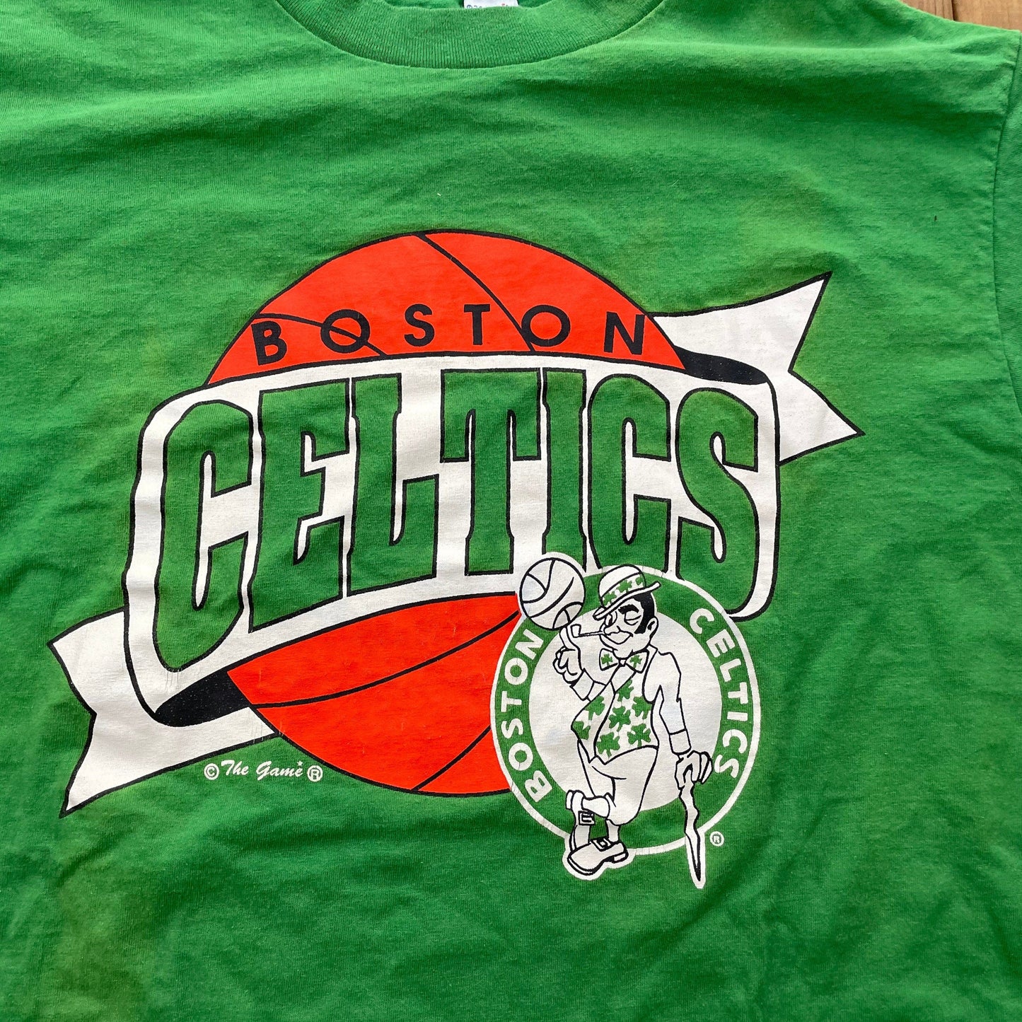 Proper Vintage Clothing > Gender Neutral Adult Clothing > Tops & Tees > T Shirts Vintage 1990s Boston Celtics The Game T-Shirt / Made In USA / Single Stitch / NBA / 90s Streetwear / Athleisure / Sportswear