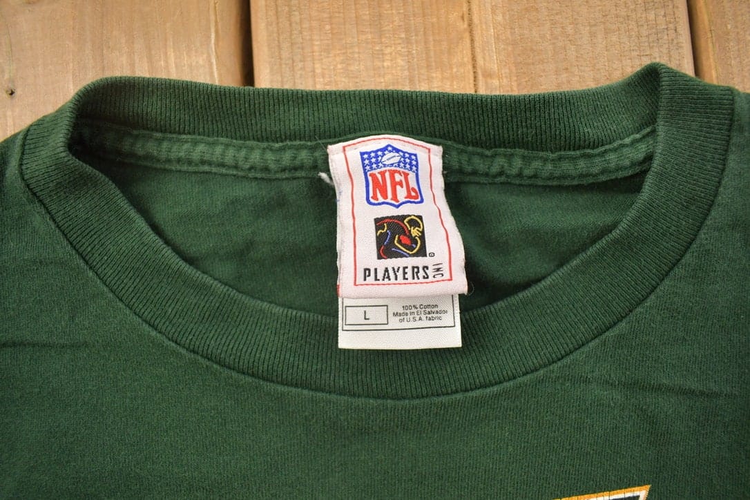 Proper Vintage Clothing > Gender Neutral Adult Clothing > Tops & Tees > T Shirts Vintage 1990s Brett Farve Green Bay Packers NFL Graphic T-Shirt / NFL / 90s Streetwear / Sportswear