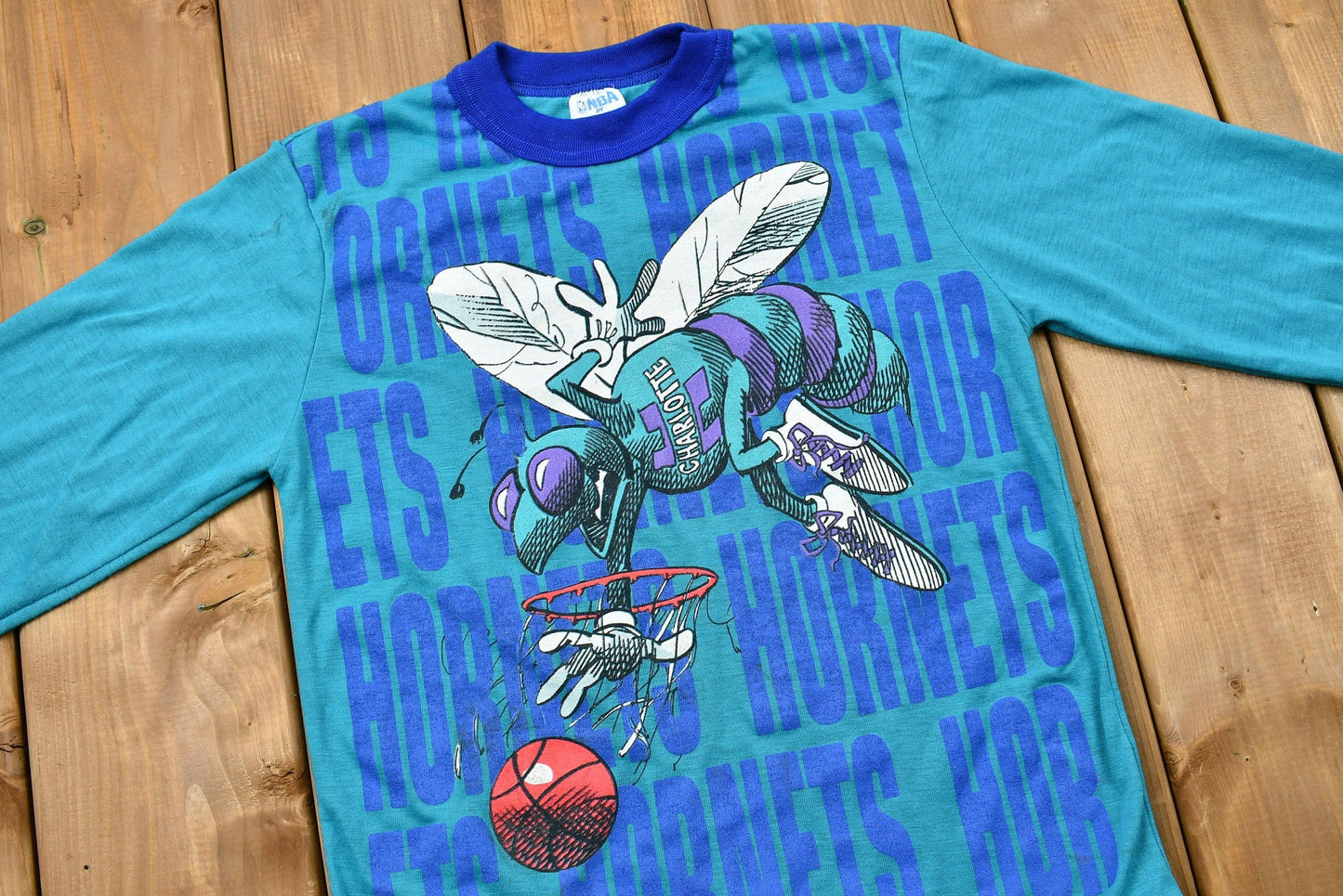 Proper Vintage Clothing > Gender Neutral Adult Clothing > Tops & Tees > T Shirts Vintage 1990s Charlotte Hornets Kid's Long Sleeve Graphic T-Shirt Youth L / NBA / 90s Streetwear / Athleisure / Sportswear