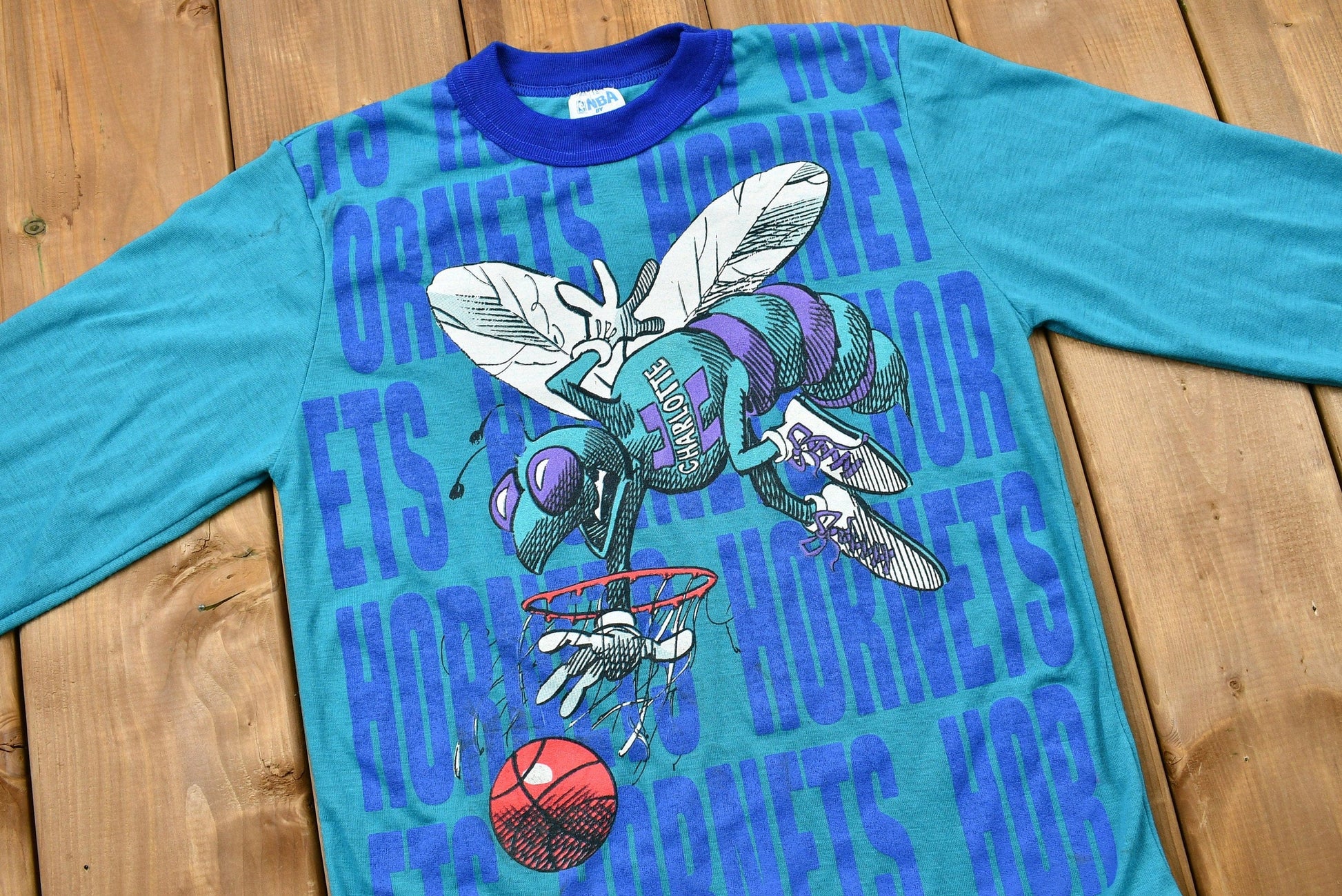 Proper Vintage Clothing > Gender Neutral Adult Clothing > Tops & Tees > T Shirts Vintage 1990s Charlotte Hornets Kid's Long Sleeve Graphic T-Shirt Youth L / NBA / 90s Streetwear / Athleisure / Sportswear