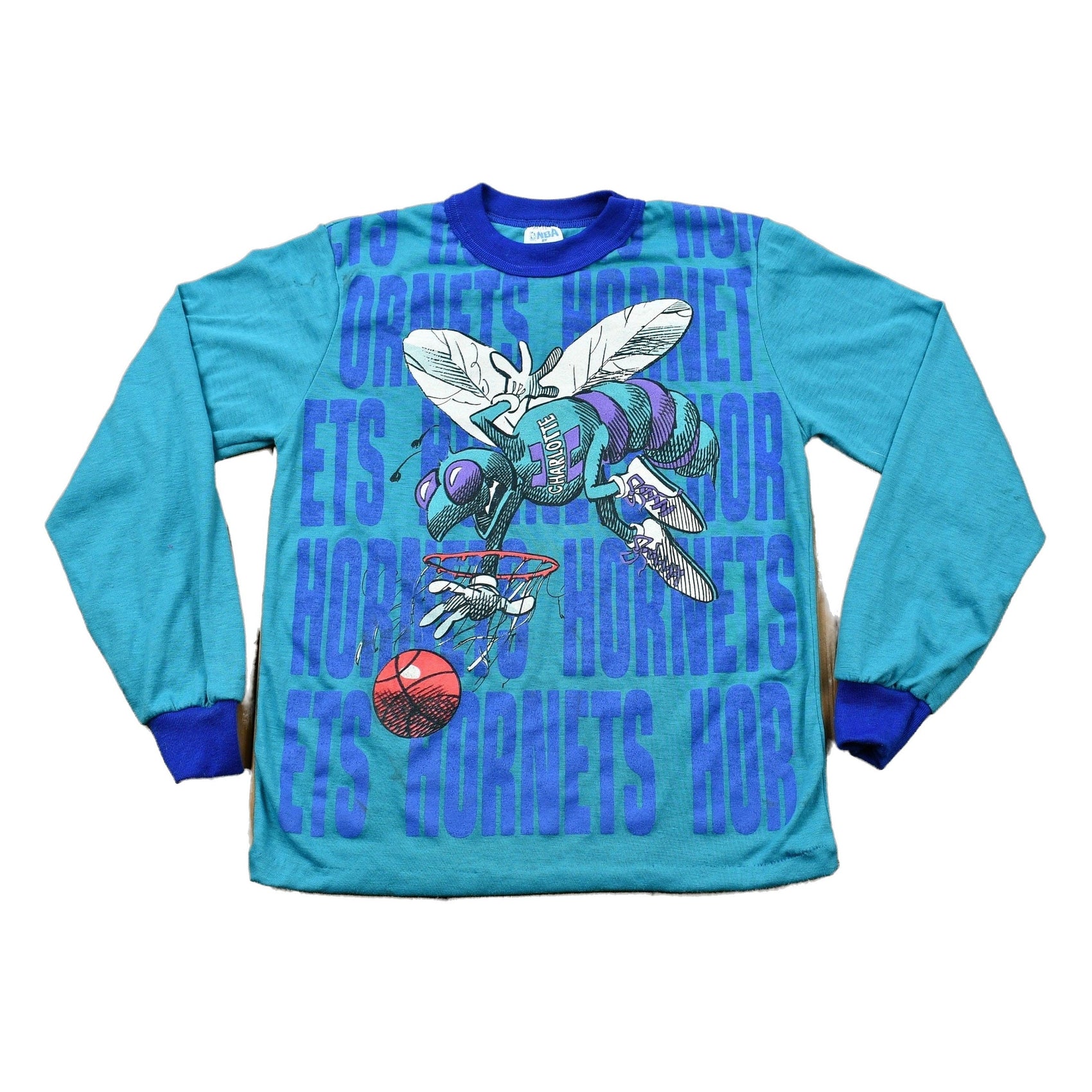 Proper Vintage Clothing > Gender Neutral Adult Clothing > Tops & Tees > T Shirts Vintage 1990s Charlotte Hornets Kid's Long Sleeve Graphic T-Shirt Youth L / NBA / 90s Streetwear / Athleisure / Sportswear