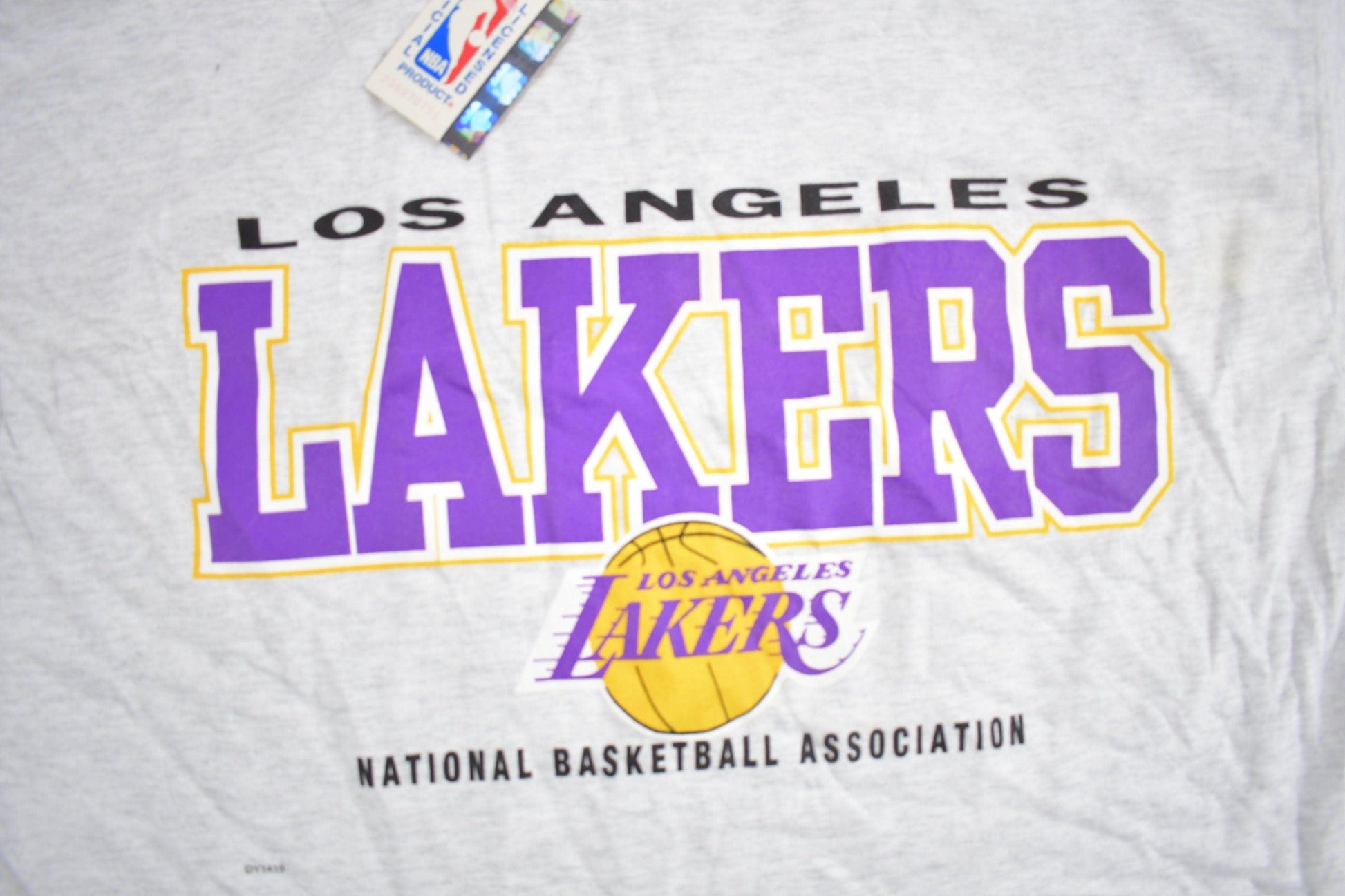 Proper Vintage Clothing > Gender Neutral Adult Clothing > Tops & Tees > T Shirts Vintage 1990s Deadstock Los Angeles Lakers NBA Graphic T-Shirt / NBA Basketball / Vintage Lakers / Sportswear / NWT