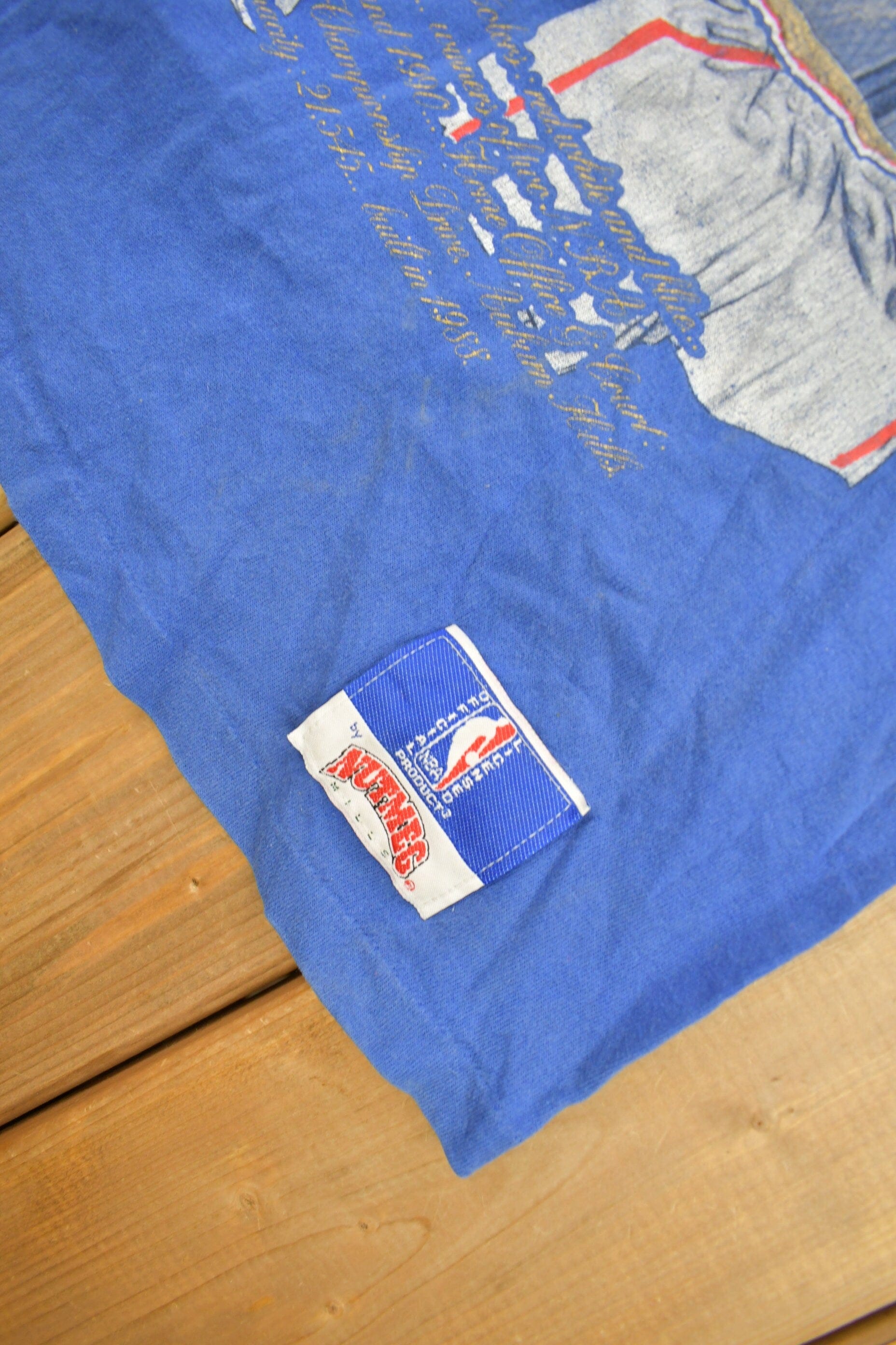 Proper Vintage Clothing > Gender Neutral Adult Clothing > Tops & Tees > T Shirts Vintage 1990s Detroit Pistons NBA Embroidered Graphic T-Shirt / Made In USA / Single Stitch / NBA Basketball / Nutmeg Sportswear