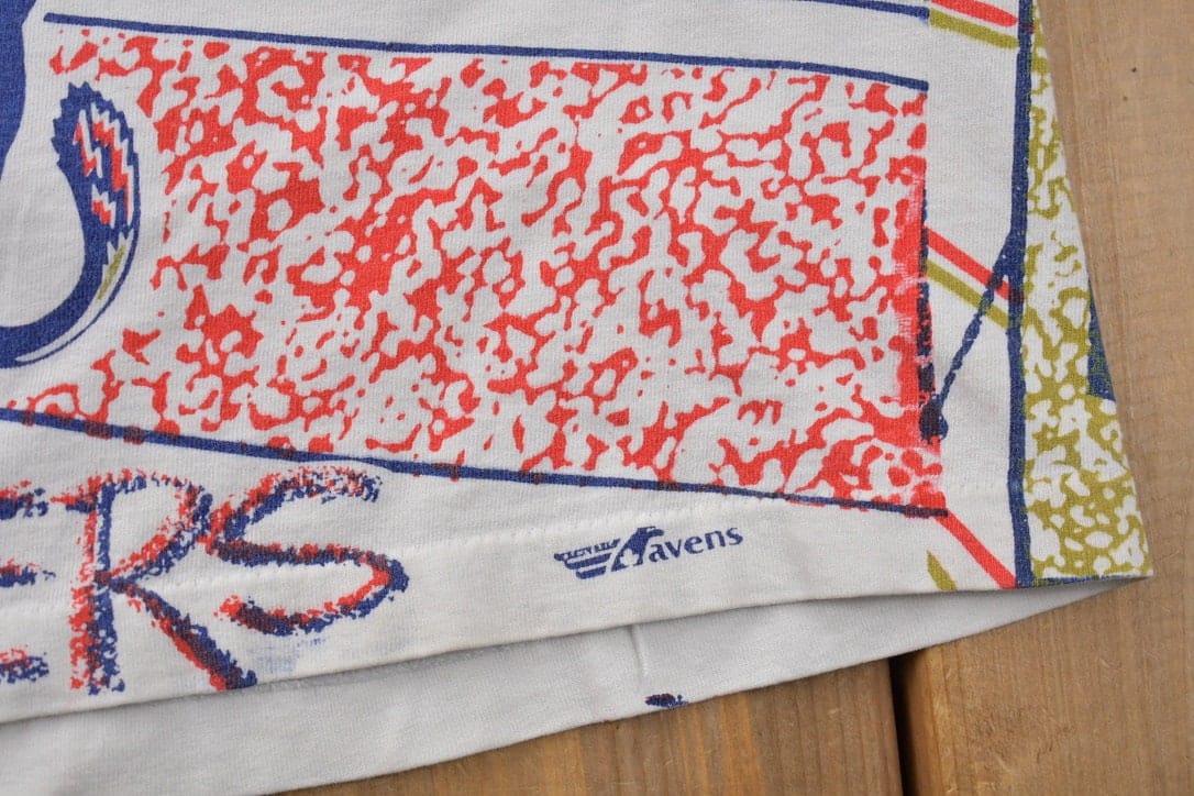 Proper Vintage Clothing > Gender Neutral Adult Clothing > Tops & Tees > T Shirts Vintage 1990s Florida Panthers All Over Print NHL Graphic Kids T-Shirt Made In Canada / Single Stitch / NHL Hockey / 90s Salem