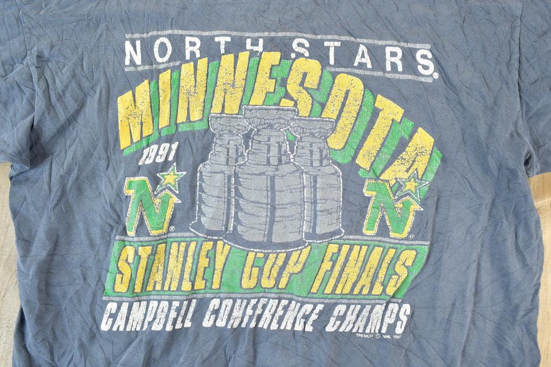 Proper Vintage Clothing > Gender Neutral Adult Clothing > Tops & Tees > T Shirts Vintage 1990s Minnesota North Stars NHL Graphic T-Shirt / Made In USA / Single Stitch / NHL Hockey / 90s Streetwear / Sportswear