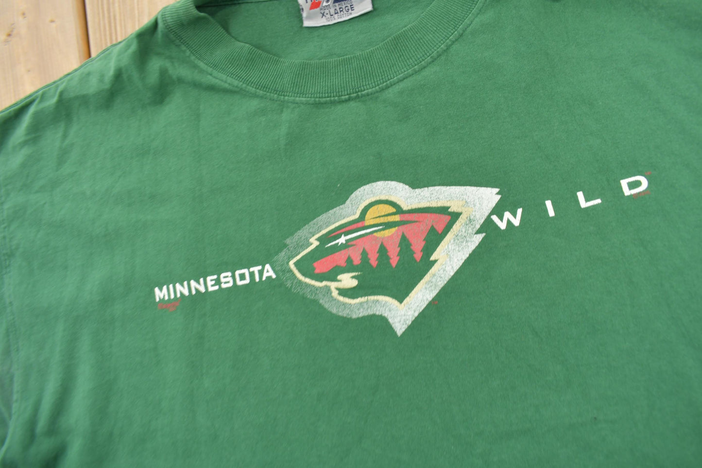 Proper Vintage Clothing > Gender Neutral Adult Clothing > Tops & Tees > T Shirts Vintage 1990s Minnesota Wild NHL Hockey Graphic T-Shirt / Size XL / Majestic