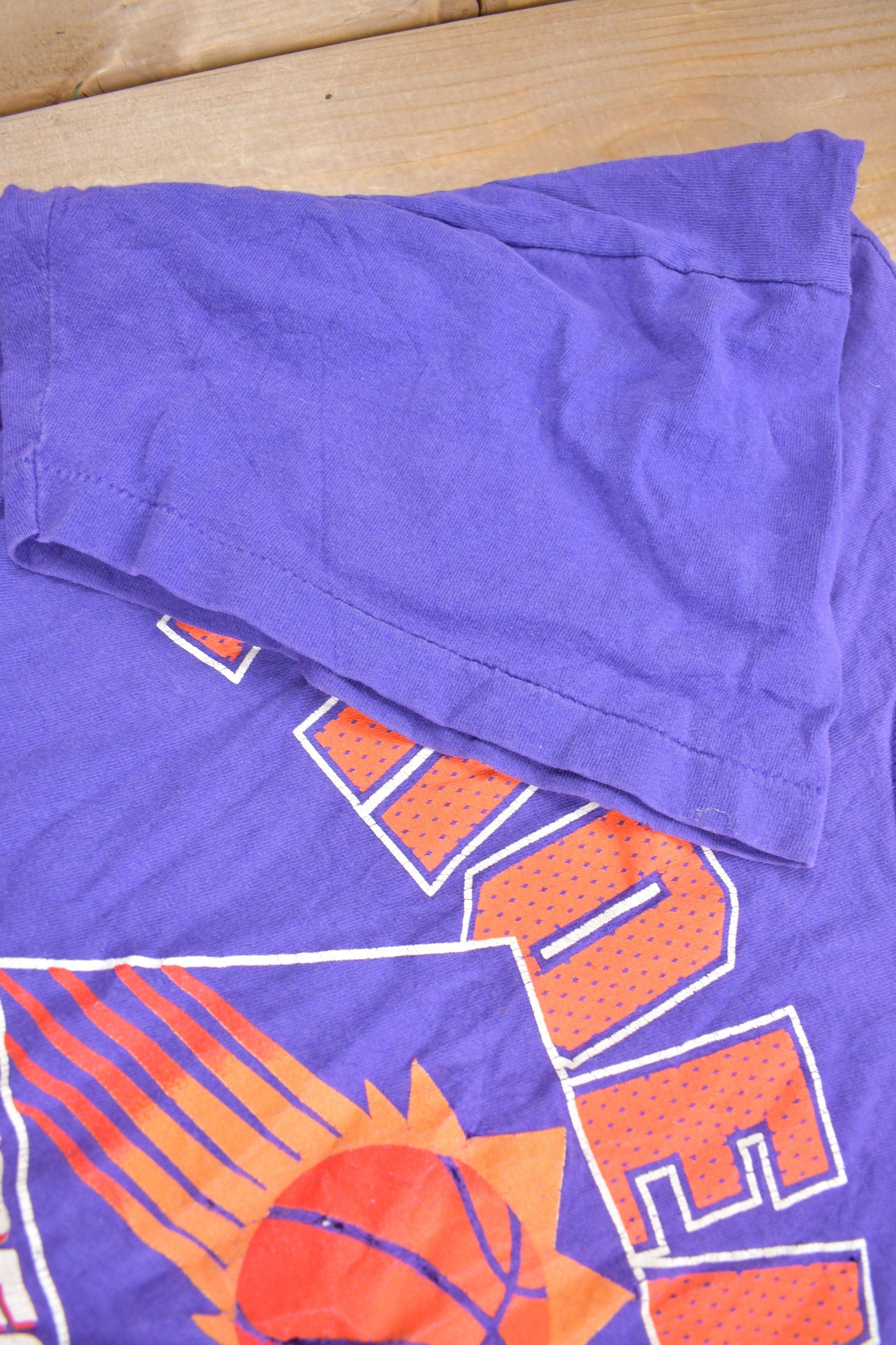 Proper Vintage Clothing > Gender Neutral Adult Clothing > Tops & Tees > T Shirts Vintage 1990s Phoenix Suns NBA Graphic T-Shirt / Made In USA / Single Stitch / NBA Basketball / 90s Streetwear / Sportswear