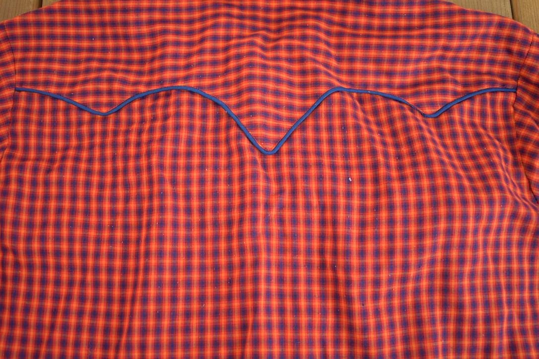 True Vintage 1980s JCPenny Western Apparel Western Cowboy Long Tail Button Up Shirt Men's XL from propervintagecanada