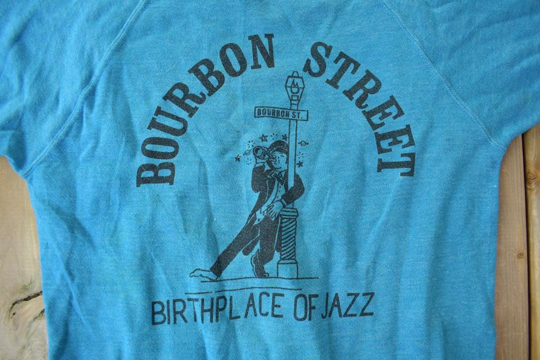 Vintage 1960s Bourbon Street Birthplace Of Jazz Short Sleeve Raglan Sweatshirt from propervintagecanada