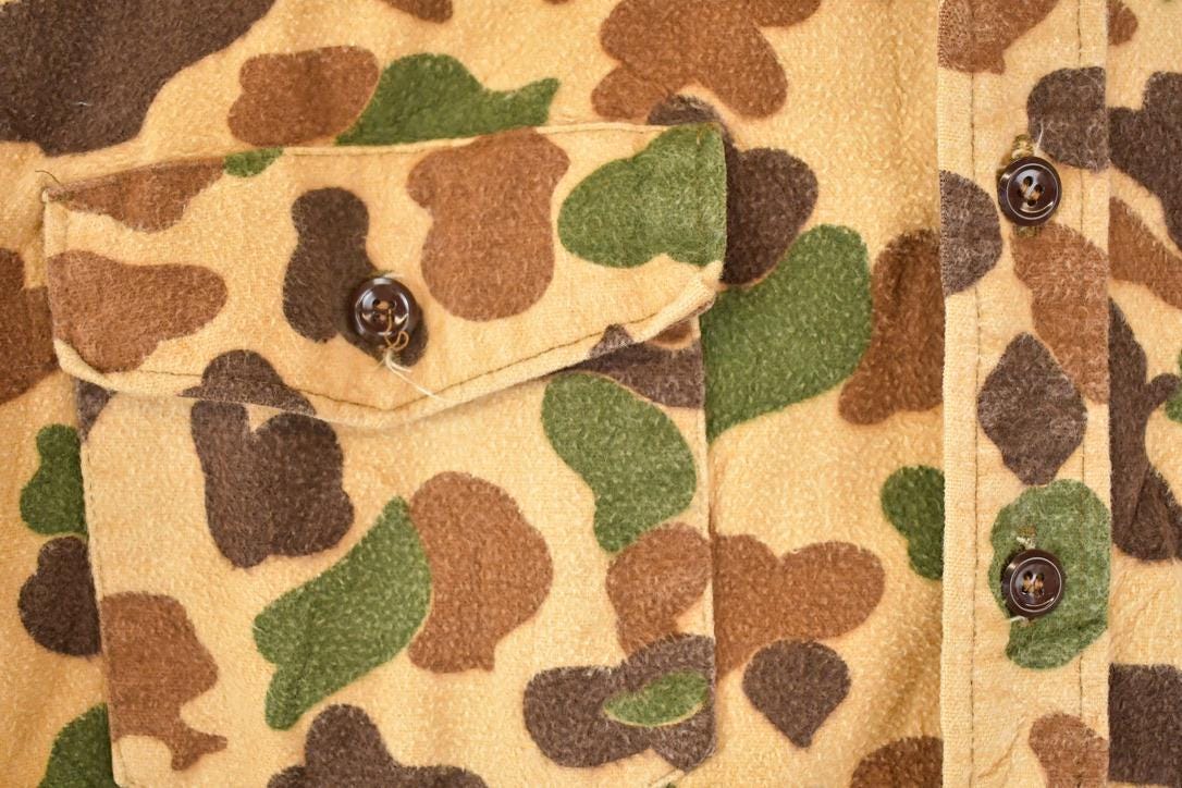 Vintage 1970s Duxbak Camo Button Up Shirt Men's L from propervintagecanada
