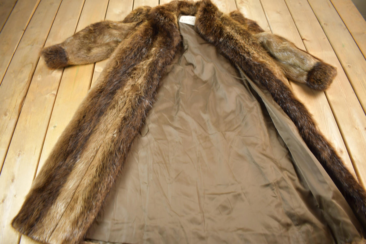 Vintage 1970s Eaton Full Length Brown Raccoon Fur Coat from propervintagecanada