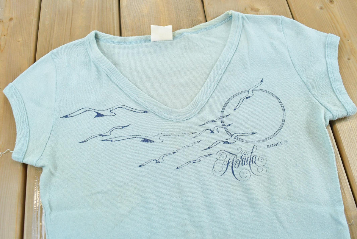 Vintage 1970s Florida Seagulls Souvenir T Shirt Baby Tee Womens S from propervintagecanada