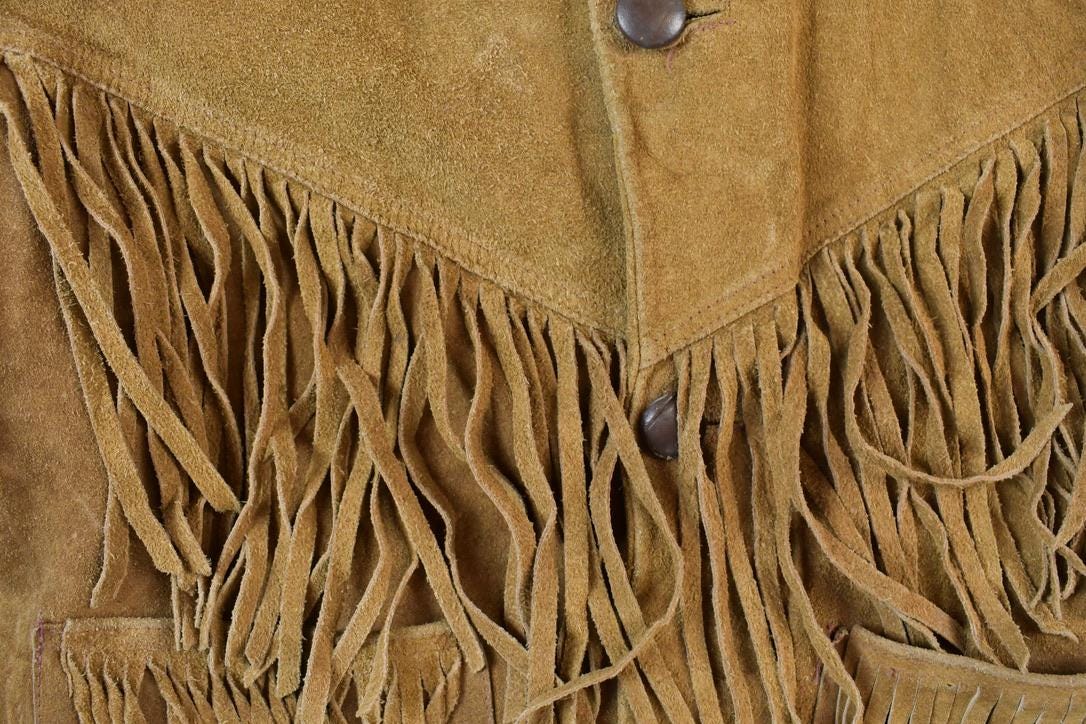 Vintage 1970s Leather Western Fringe Jacket Made In USA from propervintagecanada