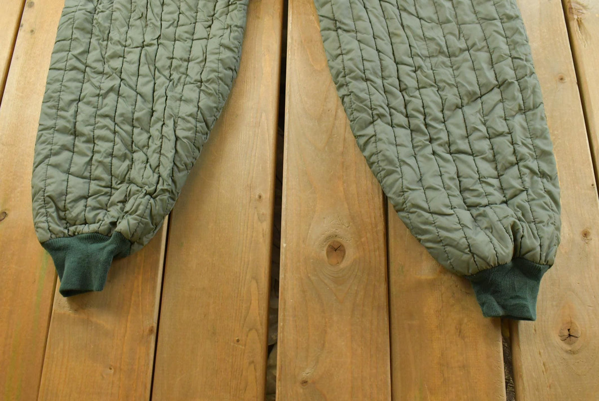 Vintage 1970s Quilted Green Military Liner Puffer Pants Men's M from propervintagecanada