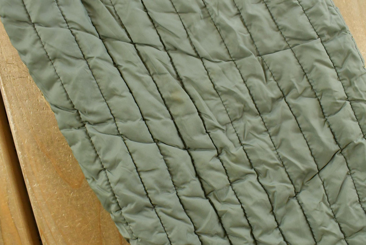 Vintage 1970s Quilted Green Military Liner Puffer Pants Men's M from propervintagecanada
