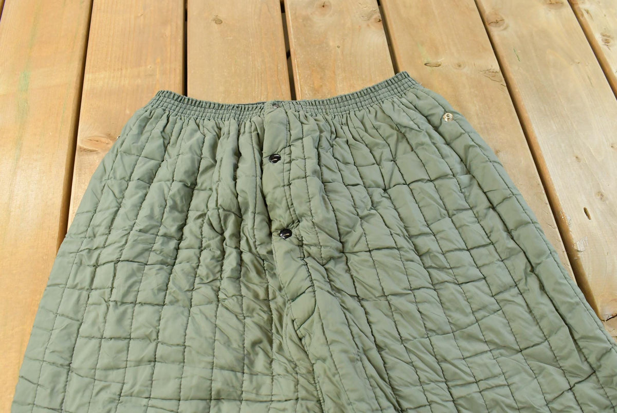 Vintage 1970s Quilted Green Military Liner Puffer Pants Men's M from propervintagecanada