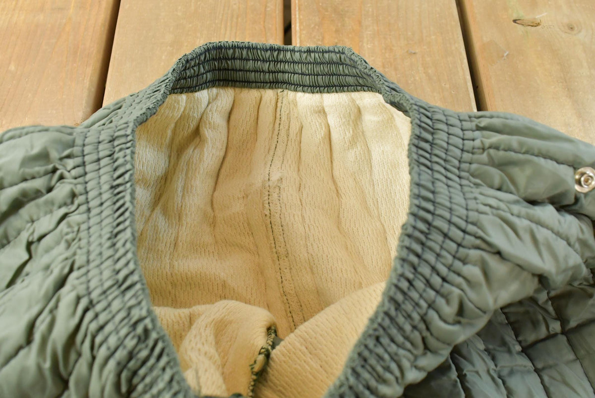 Vintage 1970s Quilted Green Military Liner Puffer Pants Men's M from propervintagecanada