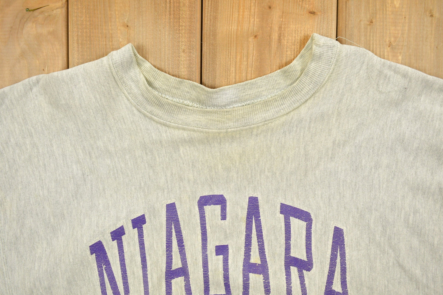 Vintage 1980's Champion Reverse Weave Warm-up Collegiate Crewneck University of Niagara Heavily Distressed Men's 2XL from propervintagecanada