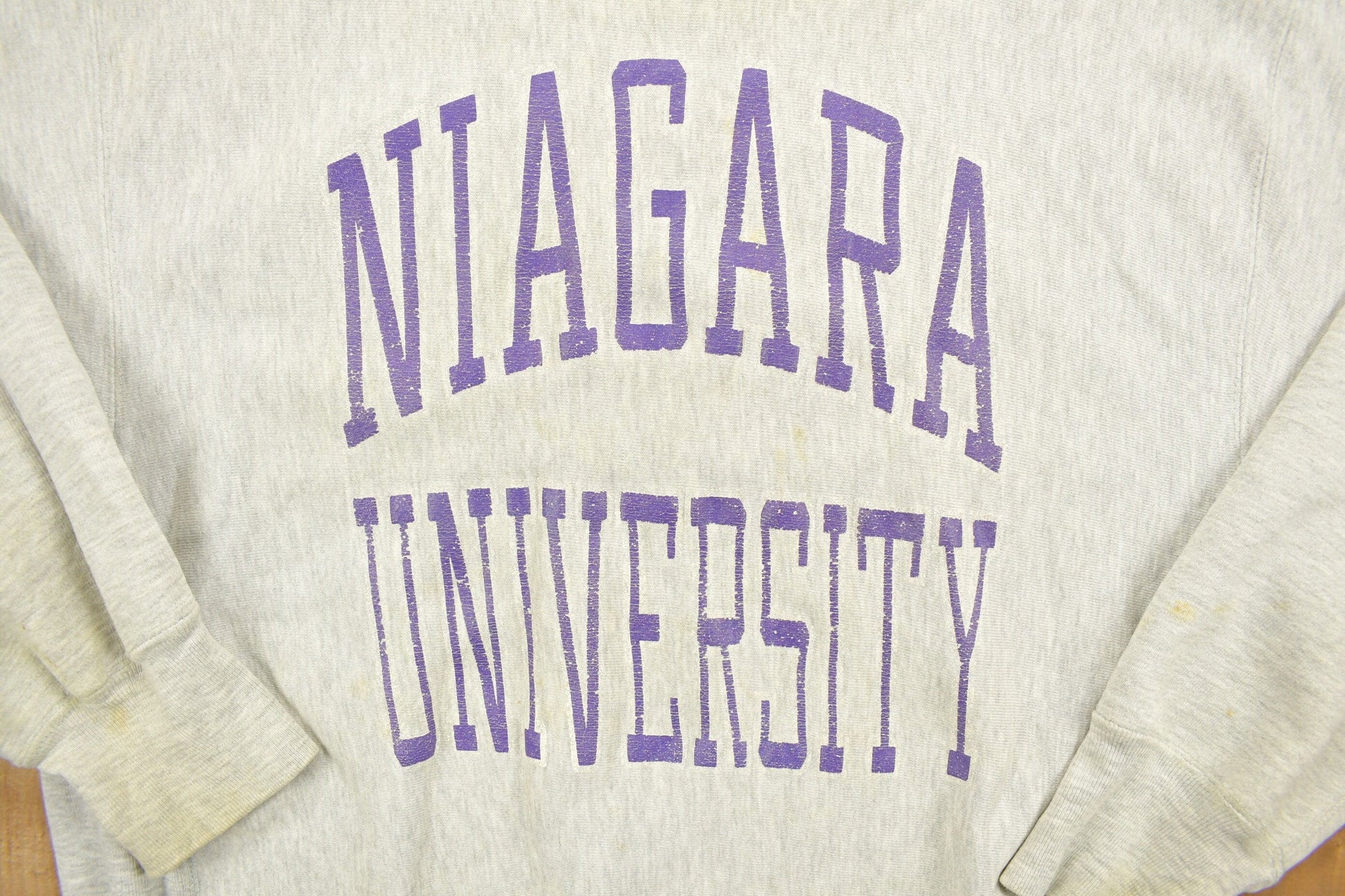 Vintage 1980's Champion Reverse Weave Warm-up Collegiate Crewneck University of Niagara Heavily Distressed Men's 2XL from propervintagecanada