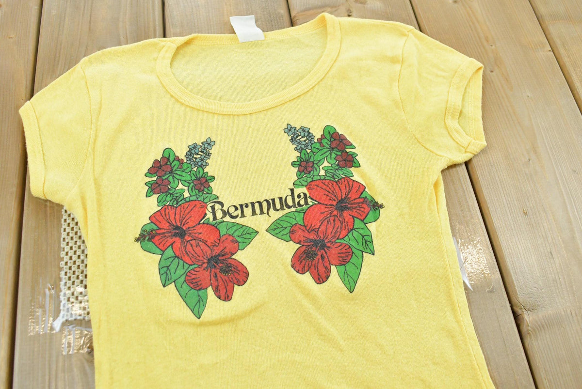 Vintage 1980s Bermuda Flowers Graphic T-Shirt Baby Tee Womens XS from propervintagecanada