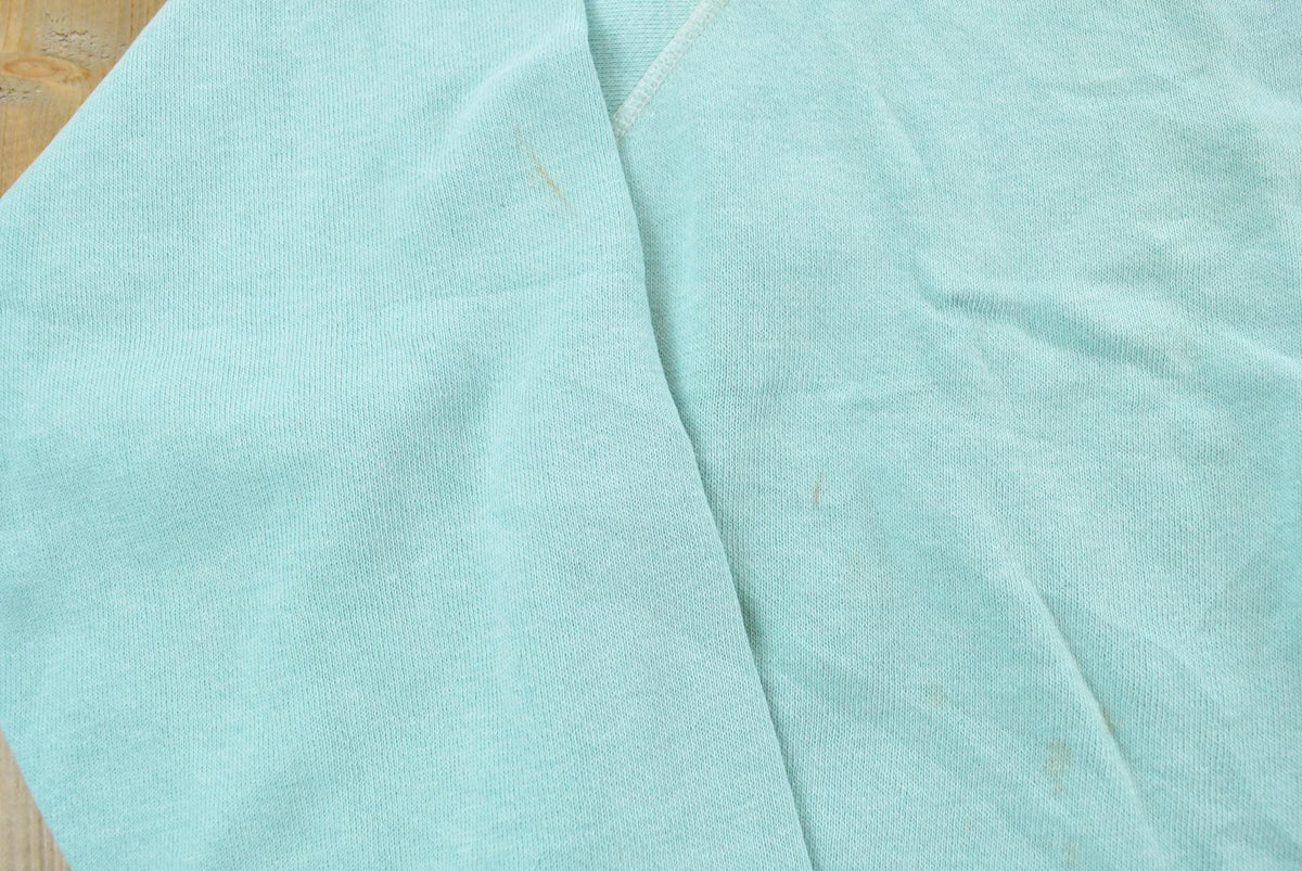 Vintage 1980s Blank Light Blue Raglan Crewneck Sweatshirt Mens S from propervintagecanada