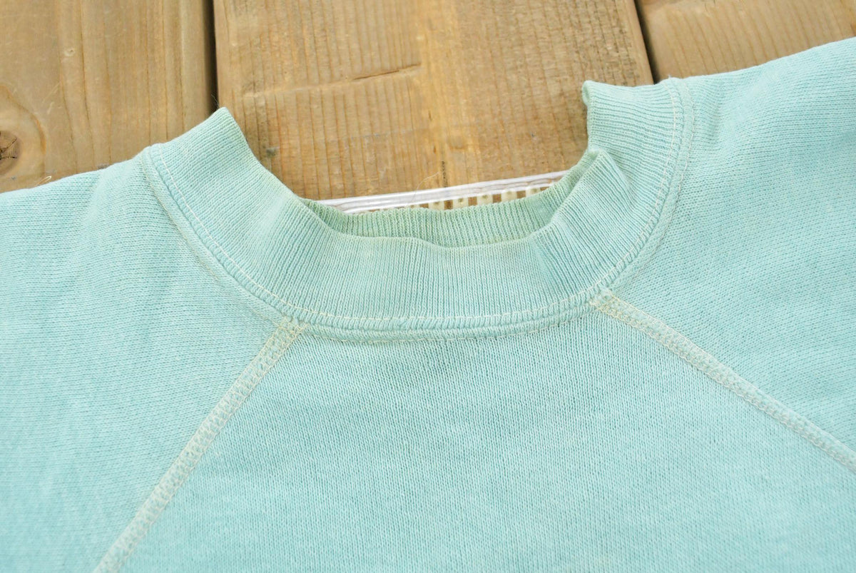 Vintage 1980s Blank Light Blue Raglan Crewneck Sweatshirt Mens S from propervintagecanada