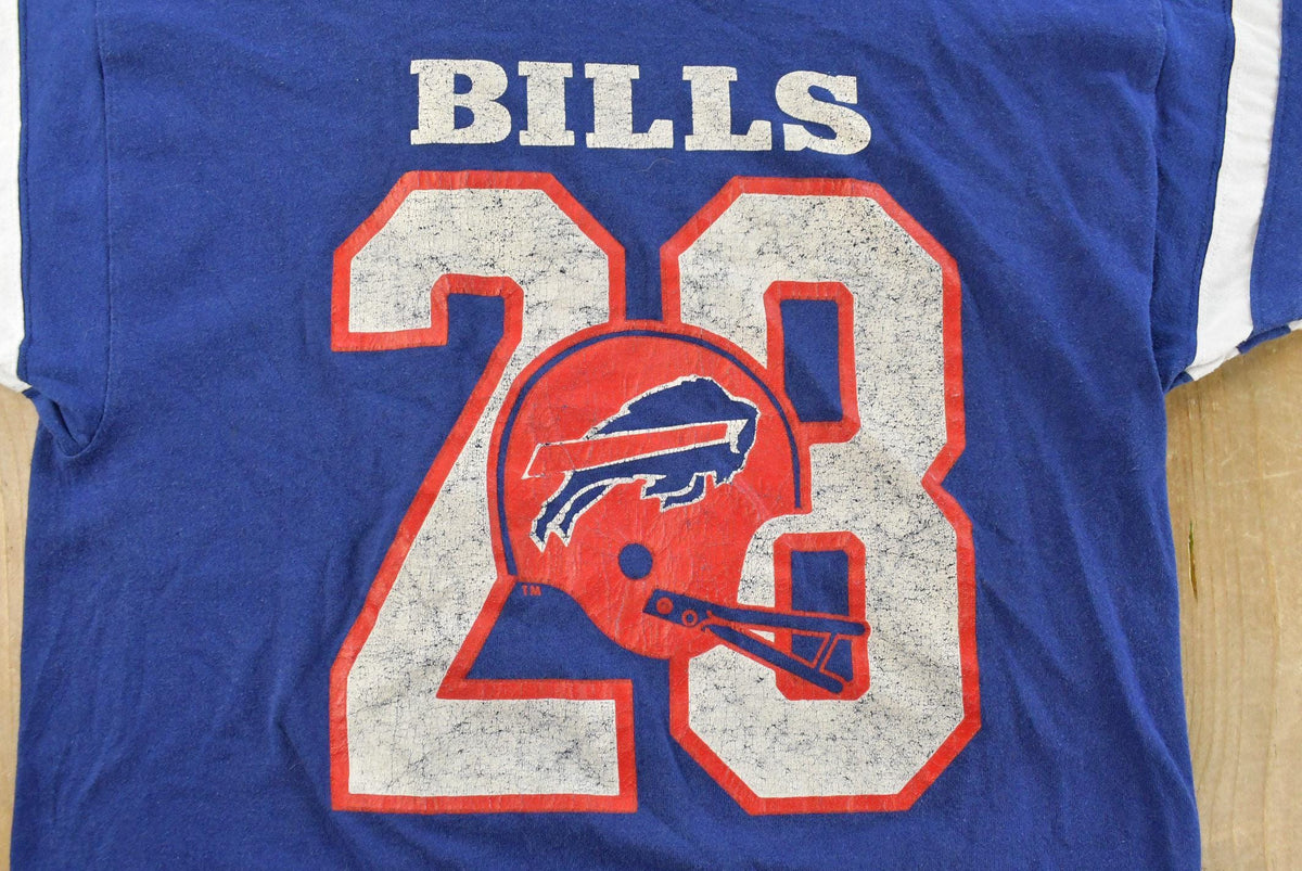 Vintage 1980s Buffalo Bills Champion NFL Graphic Jersey T-Shirt Men's S from propervintagecanada