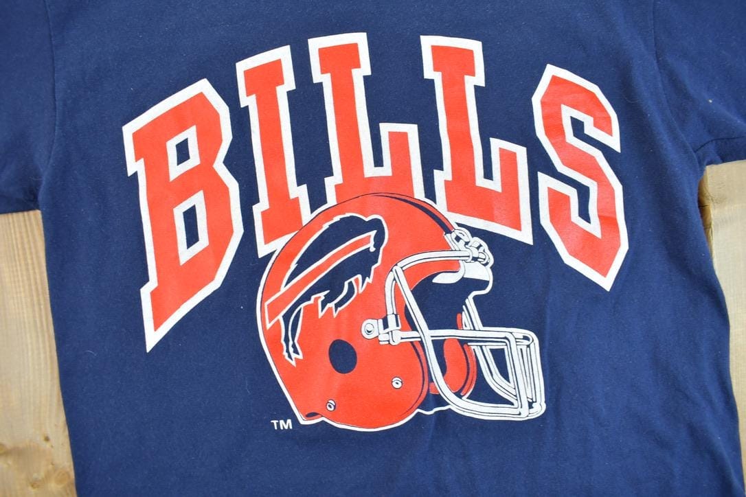 Vintage 1980s Buffalo Bills NFL Graphic T-Shirt Men's Medium from propervintagecanada
