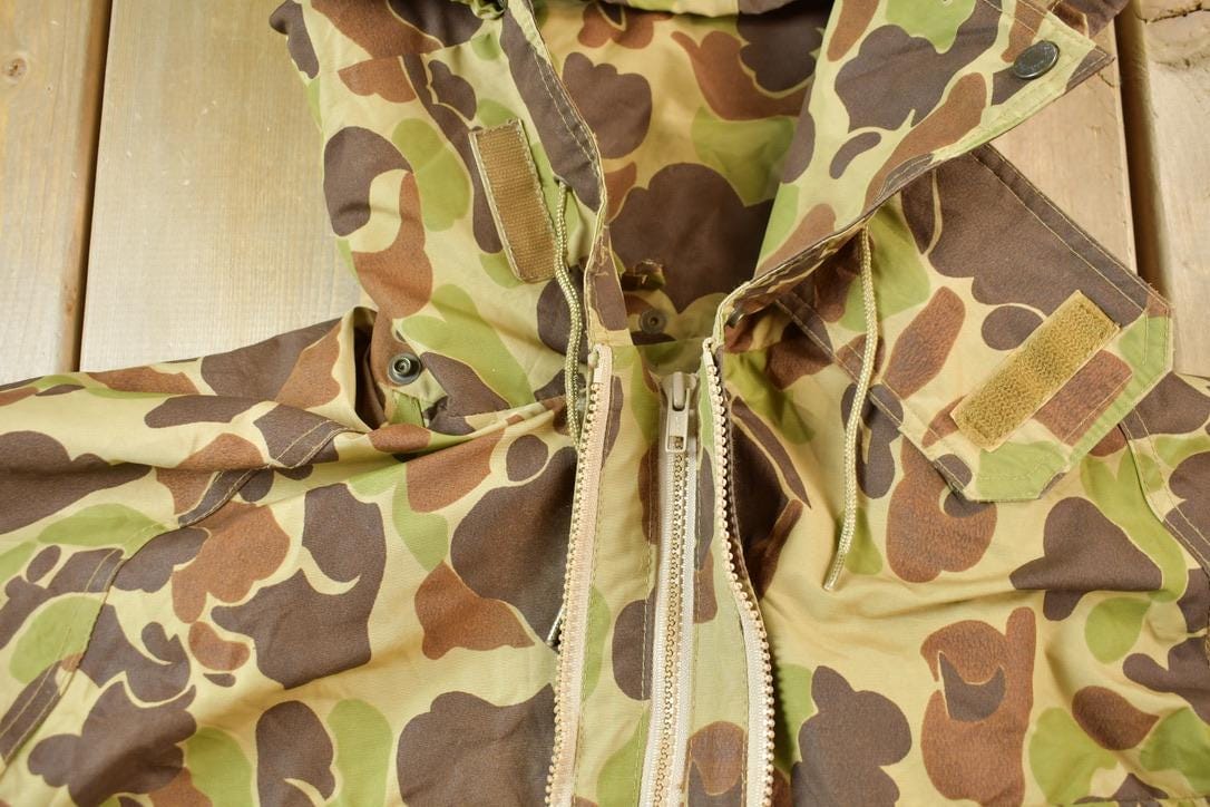 Vintage 1980s Cabela's Duck Camo Canvas Jacket Men's XL from propervintagecanada
