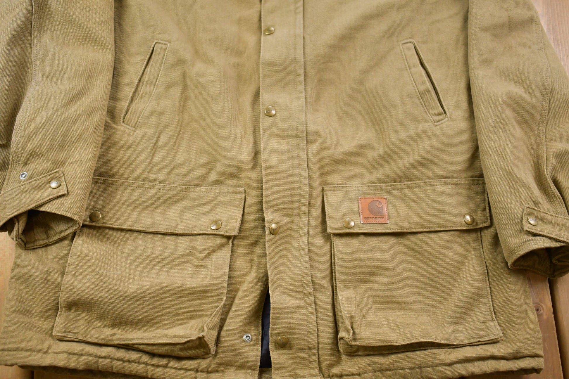 Vintage 1980s Carhartt Chore Coat Olive Green Men's XL Tall from propervintagecanada