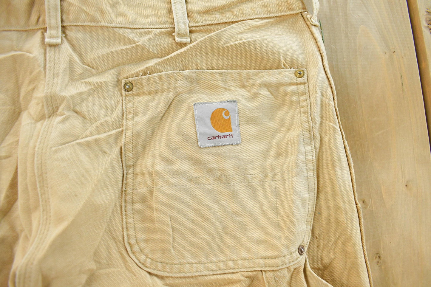 Vintage 1980s Carhartt Distressed Sun Faded Double Knee Pants Men's 37 x 29 from propervintagecanada