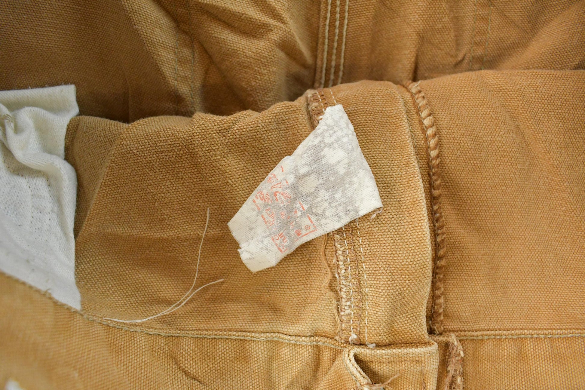 Vintage 1980s Carhartt Distressed Sun Faded Double Knee Pants Men's 37 x 29 from propervintagecanada