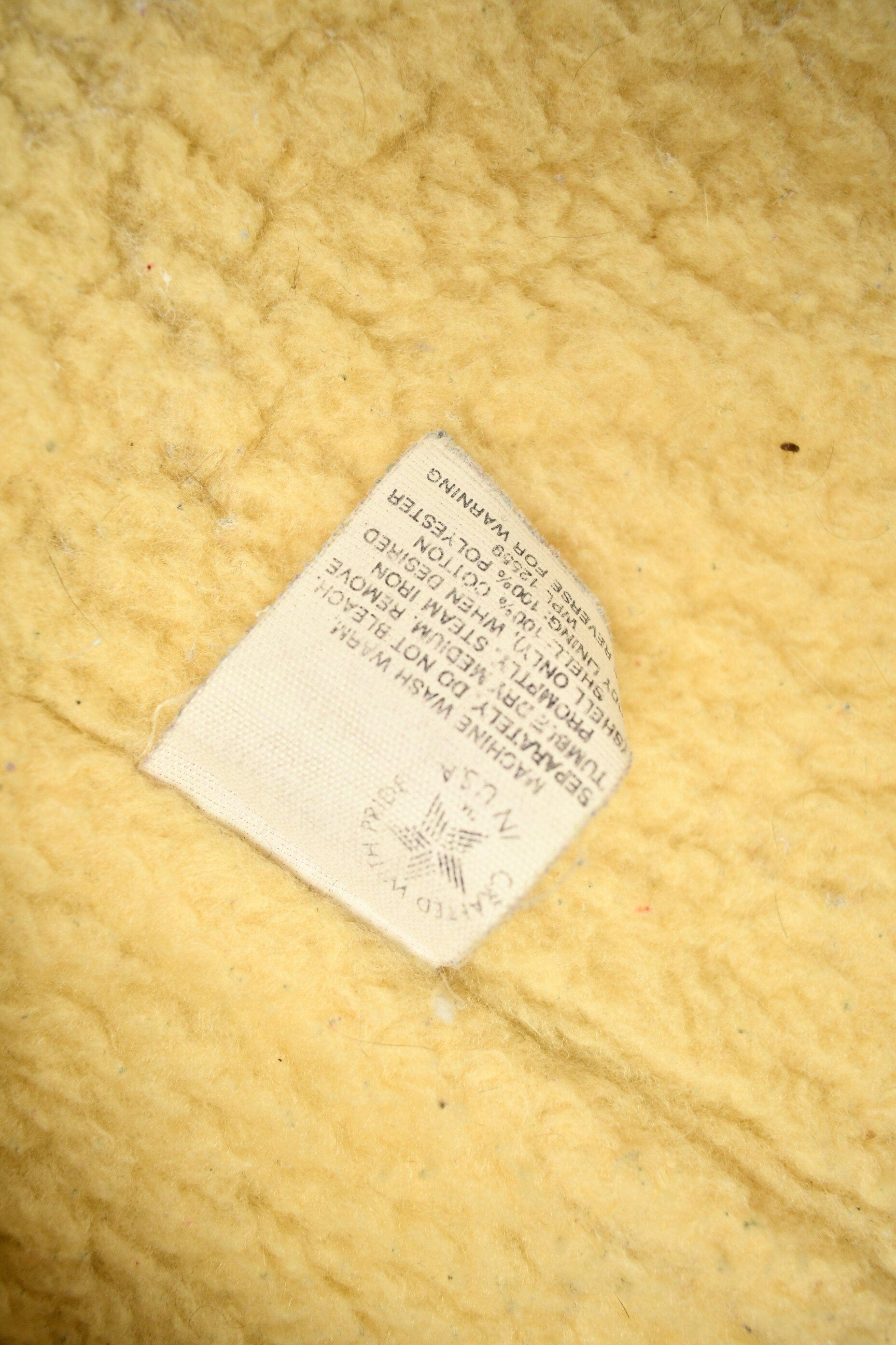 Vintage 1980s Carhartt Sherpa Lined Beige Work Vest from propervintagecanada