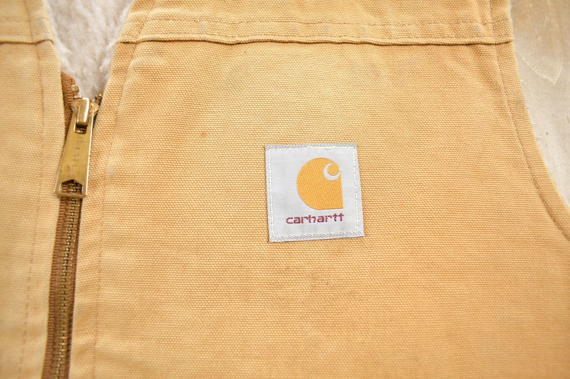 Vintage 1980s Carhartt Sherpa Lined Beige Work Vest Men's Large from propervintagecanada