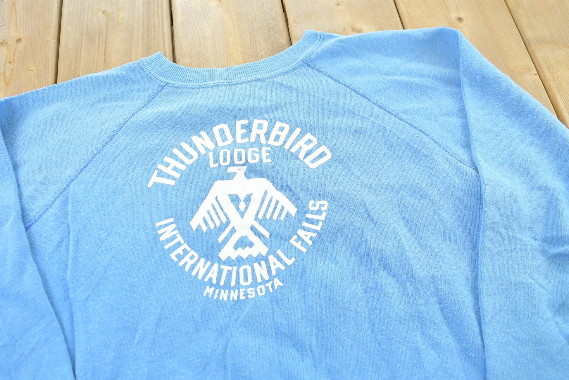 Vintage 1980s Collegiate Pacific Thunderbird Lodge Minnesota Souvenir Travel Crewneck Sweatshirt Mens M from propervintagecanada