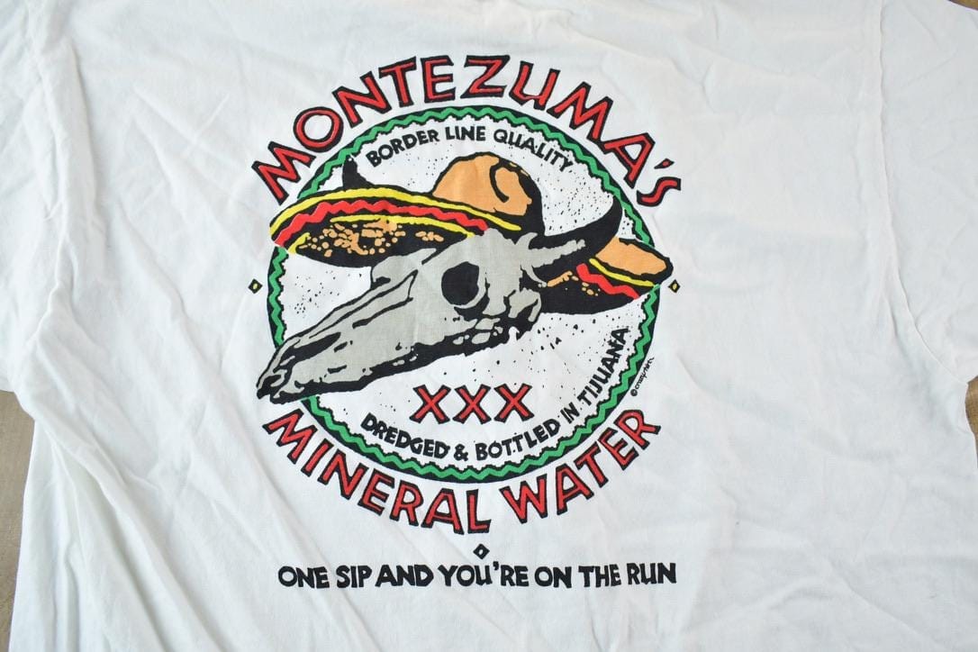Vintage 1980s Crazy Shirts Montezumas Mineral Water Souvenir Single Stitch Graphic Print T-Shirt Men's Large from propervintagecanada