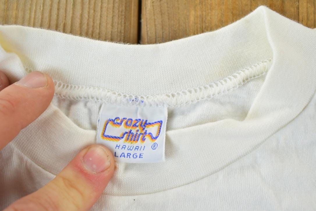 Vintage 1980s Crazy Shirts Montezumas Mineral Water Souvenir Single Stitch Graphic Print T-Shirt Men's Large from propervintagecanada