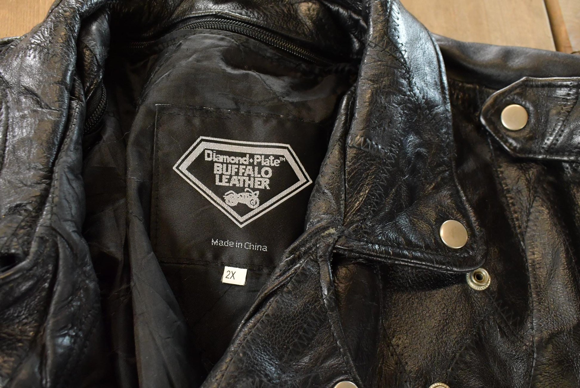 Vintage 1980s Diamond Plate Buffalo Leather Biker Motorcycle Jacket Men's 2XL from propervintagecanada