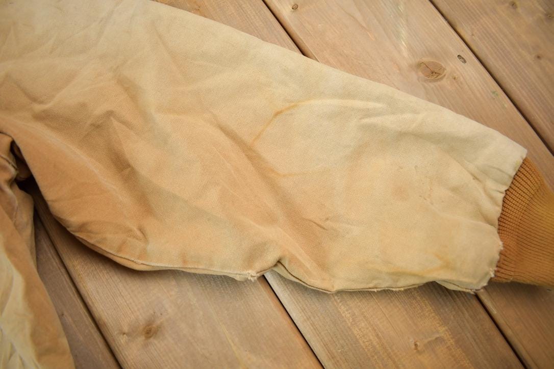 Vintage 1980s Distressed Carhartt Beige Work Jacket Men's XL from propervintagecanada