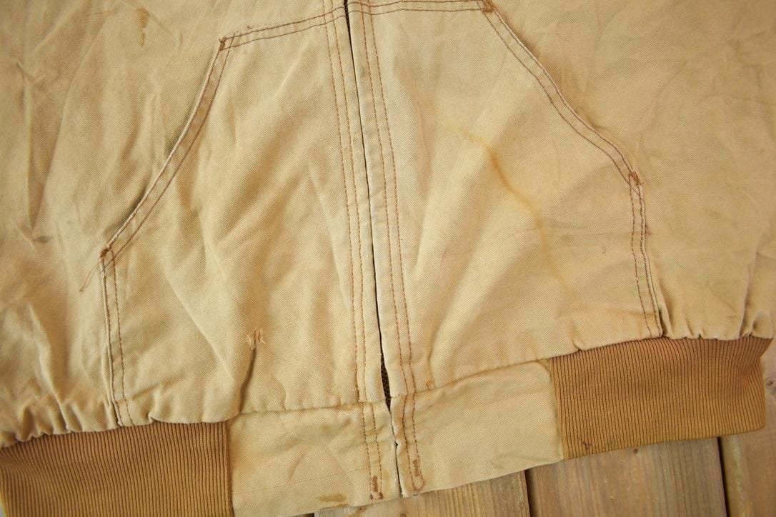 Vintage 1980s Distressed Carhartt Beige Work Jacket Men's XL from propervintagecanada