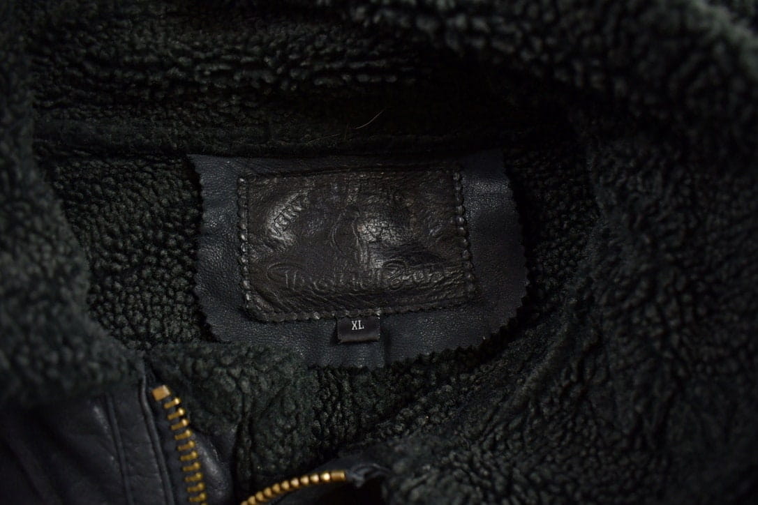 Vintage 1980s Dona Black Leather Hooded Flight Jacket Men's Large from propervintagecanada