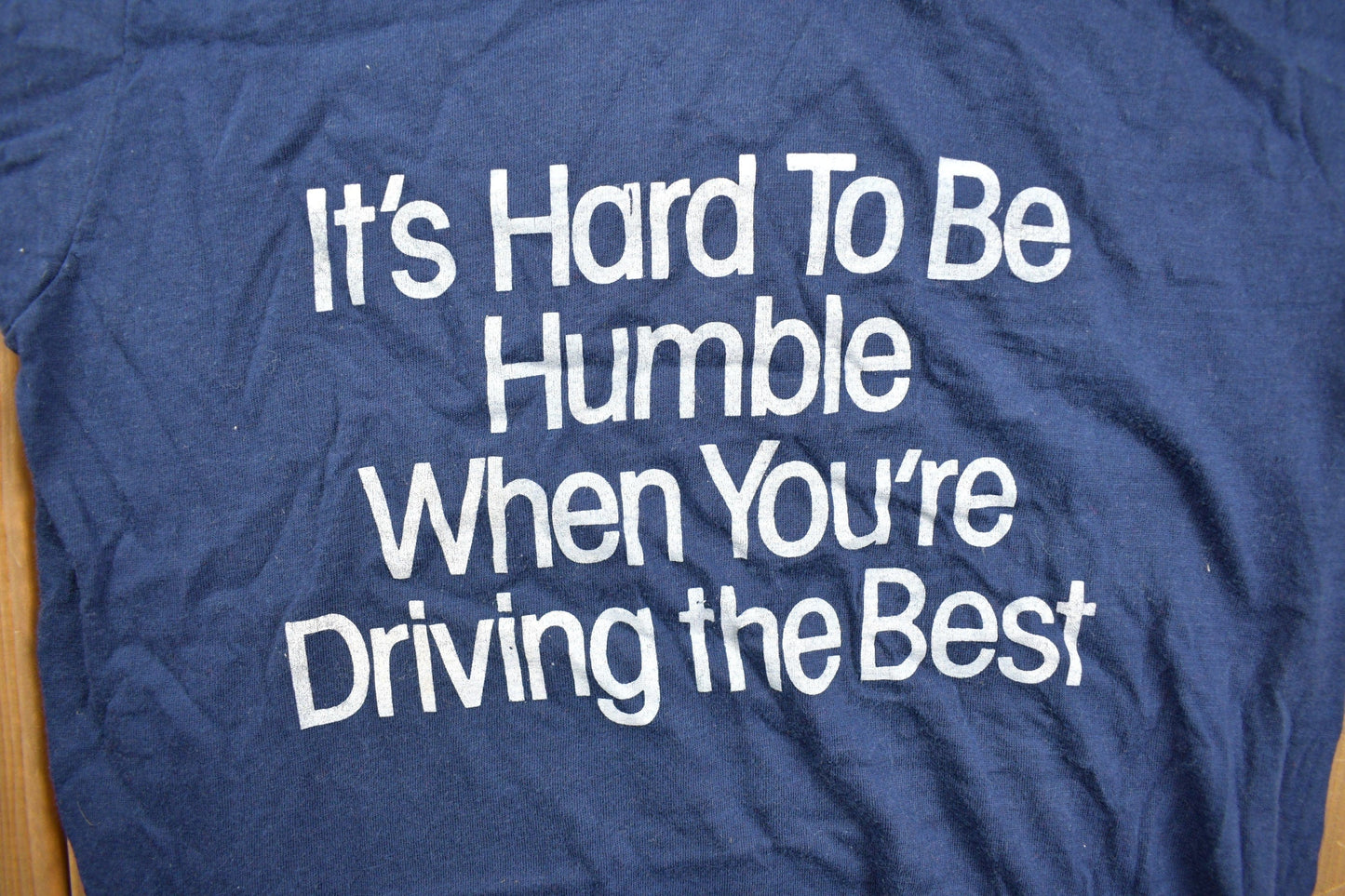 Vintage 1980s "Its Hard To Be Humble When You're Driving The Best" Graphic T Shirt Men's XS from propervintagecanada