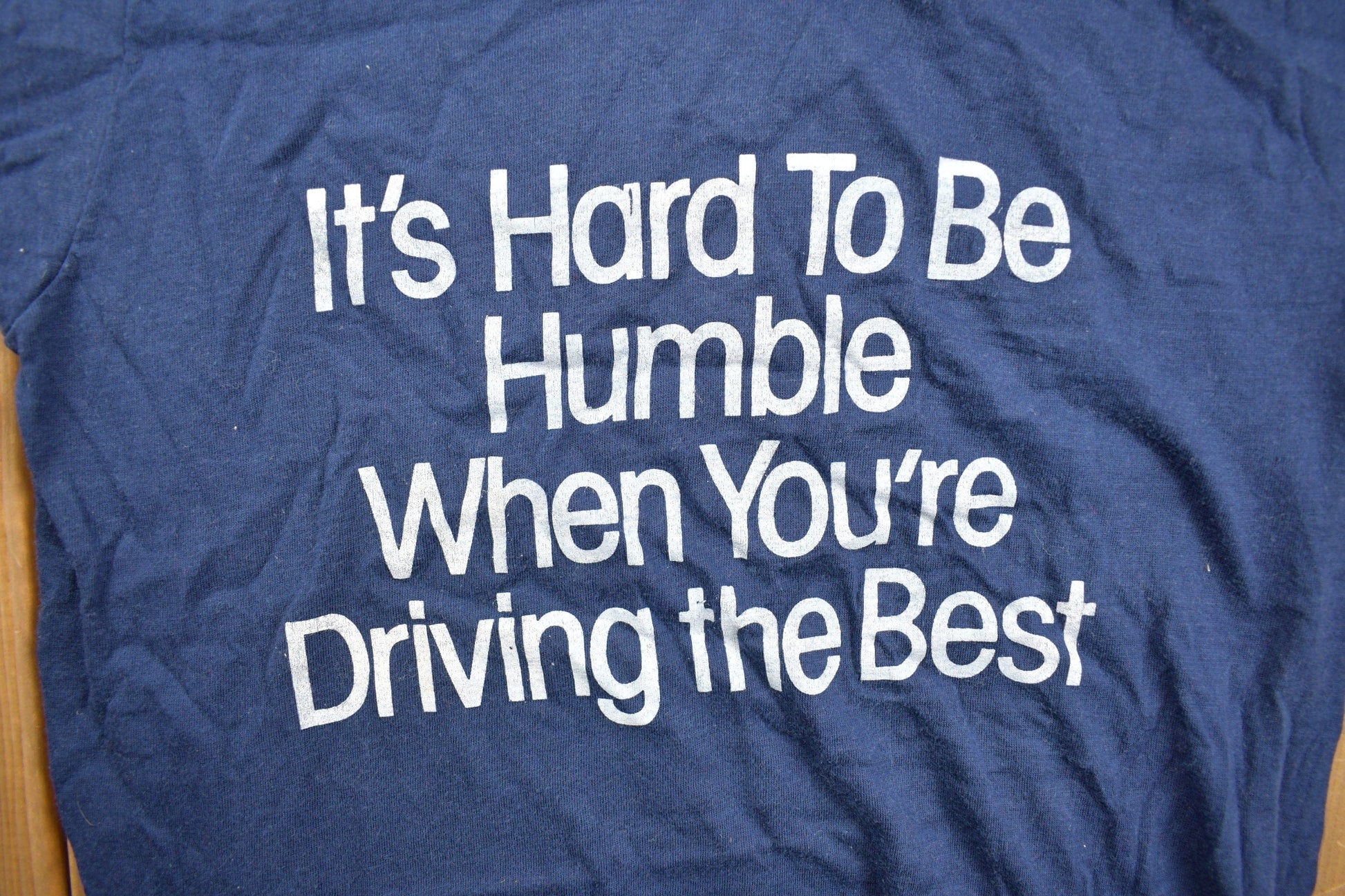 Vintage 1980s "Its Hard To Be Humble When You're Driving The Best" Graphic T Shirt Men's XS from propervintagecanada
