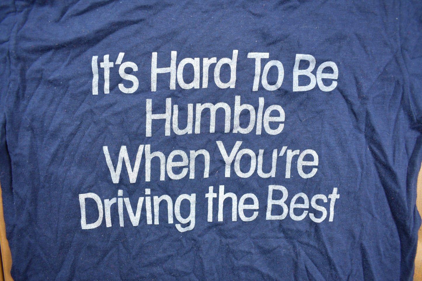 Vintage 1980s "Its Hard To Be Humble When You're Driving The Best" Graphic T Shirt Men's XS from propervintagecanada