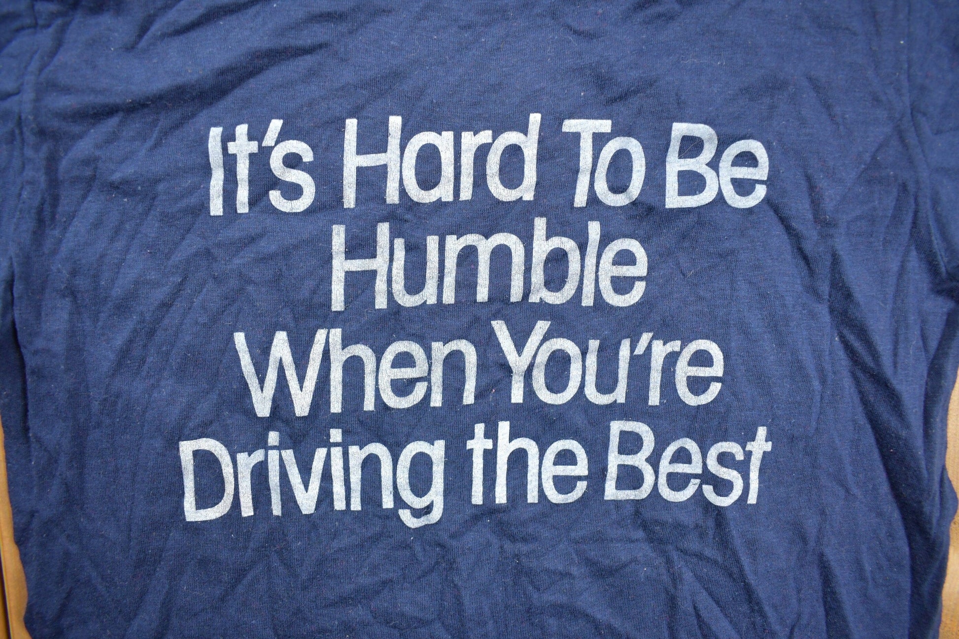 Vintage 1980s "Its Hard To Be Humble When You're Driving The Best" Graphic T Shirt Men's XS from propervintagecanada
