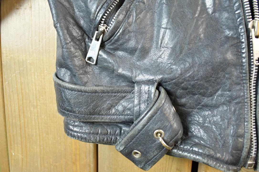 Vintage 1980s Leather Gold Harley Davidson Motorcycle Perfectly Distressed Biker Jacket Made In USA from propervintagecanada